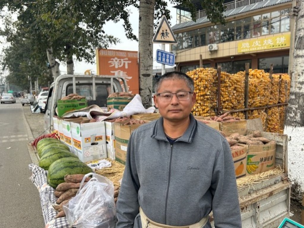 Wang Huai Ming at his vegetable stall
Photo: Denis Staunton