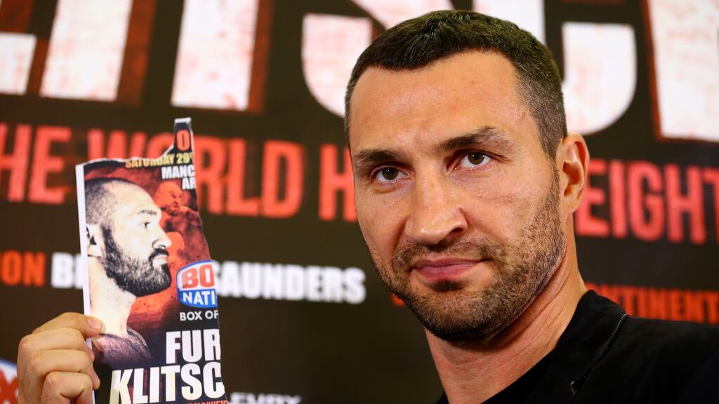 Wladimir Klitschko poses with an image of Tyson Fury after he failed to appear at a press conference ahead of the world heavyweight title rematch between the pair. Photo: Dan Istitene/Getty Images