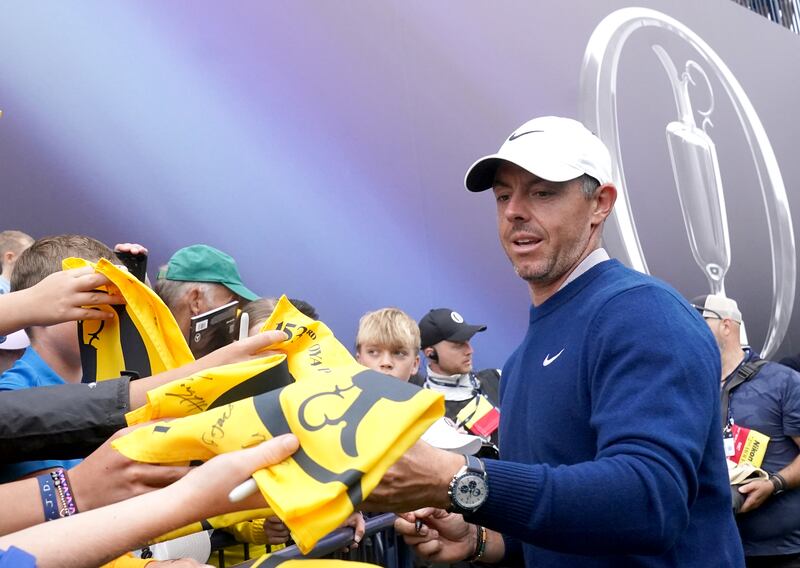 Rory McIlroy signs autographs at the 18th green after finishing his practice round. Photograph: Brian Lawless/PA Wire