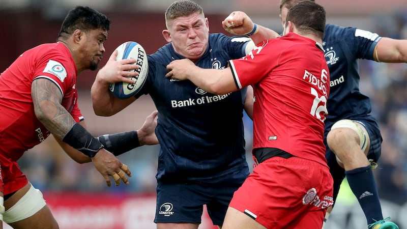 Leinster’s Tadhg Furlong is tackled by Toulouse’s Joe Tekori and Dorian Aldegheri. Photograph: Dan Sheridan/Inpho