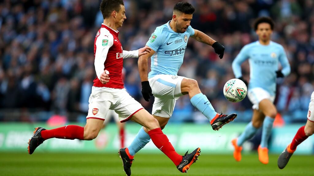 Sergio Agüero scores Manchester City’s first goal in the English League Cup final win over Arsenal at Wembley last Sunday. Photograph: Julian Finney/Getty Images