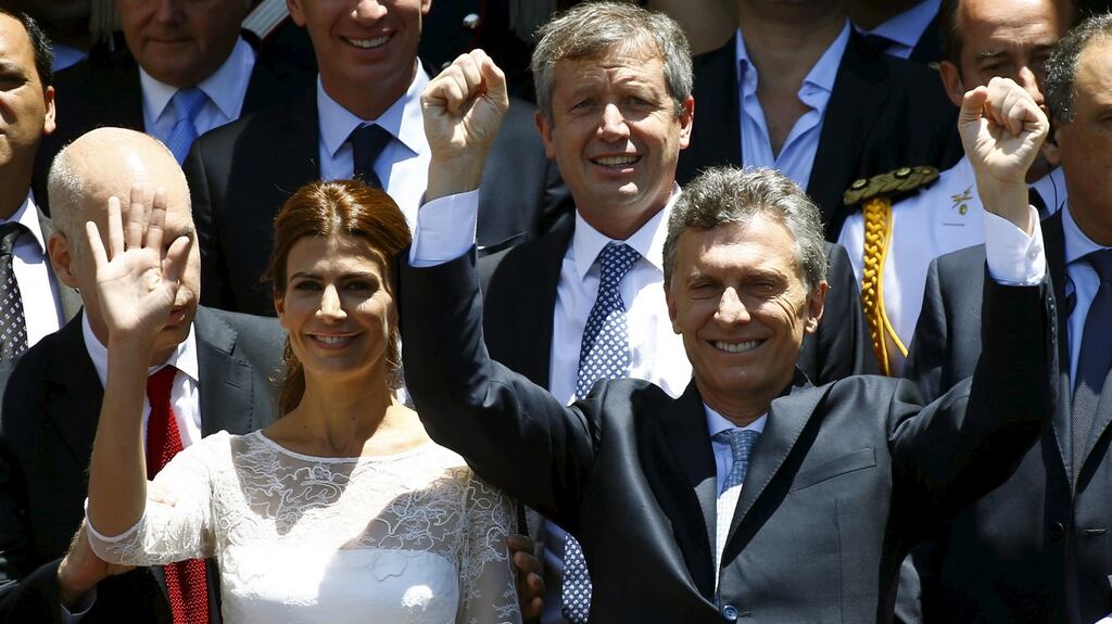 Argentina’s president Mauricio Macri and his wife Juliana Awada wave at the crowd after being sworn-in as president in Buenos Aires, Argentina. Photograph: Enrique Marcarian/Reuters