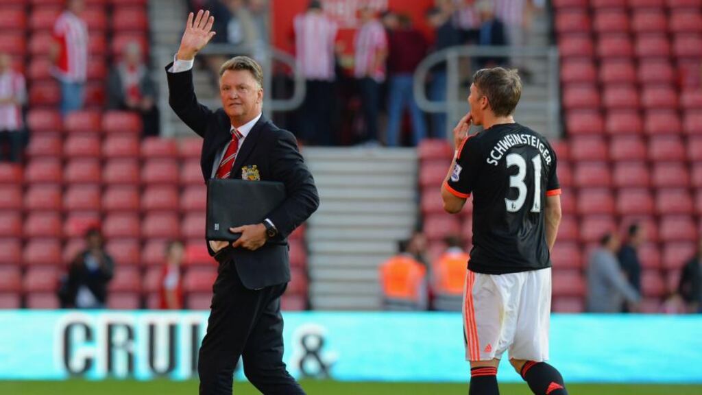 Louis van Gaal manager of Manchester United waves to the travelling fans after victory in the Barclays Premier League match against Southampton. Photograph: Tony Marshall/Getty Images