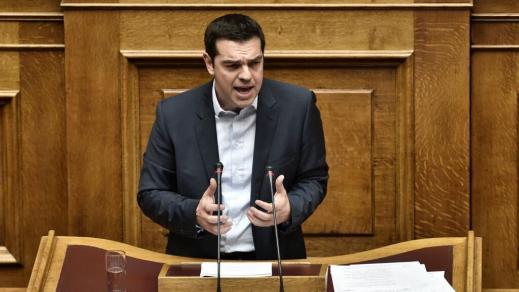 Greek prime minister Alexis Tsipras addresses the parliament during his policy speech in Athens on Sunday night. He said Greece did not want an extension of its bailout but a bridge programme which would buy the country time to negotiate a new deal. Photograph: Aris Messinisaris Messinis/AFP/Getty Images.
