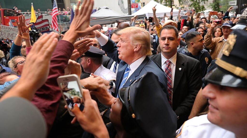 Donald Trump greets supporters outside of Trump Towers in Manhattan on Saturday. Photograph: Spencer Platt/Getty Images
