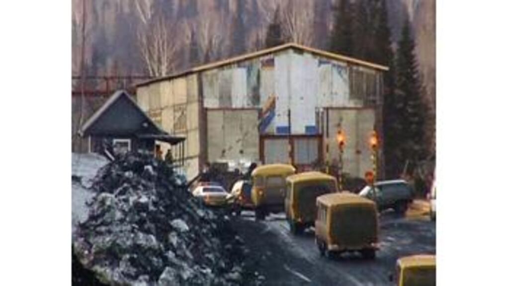 A column of buses with rescuers enters Ulyanovskaya mine near
Novokuznetsk yesterday. A methane gas explosion ripped through the
mine yesterday killing dozens among about 200 working underground.
Photograph: AP Photo/RTR Russian Channel