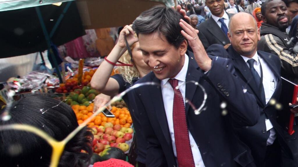 Labour leader Ed Miliband after he was pelted with eggs during a campaign visit in East Street market in Walworth, south London. Photograph: Lewis Whyld/PA Wire