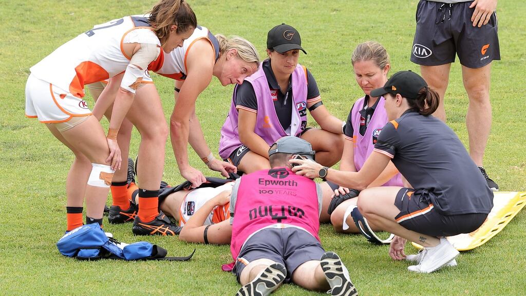 Bríd Stack of the Giants is attended to by medical staff during the AFLW pre-season match between the Adelaide Crows and the GWS Giants at Norwood Oval in Adelaide, Australia. Photo: Daniel Kalisz/Getty Images