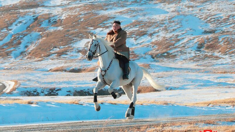 North Korean leader Kim Jong Un rides a white horse to climb Mount Paektu, North Korea. Photograph: Korea News Service/AP.