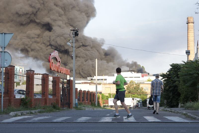 Smoke rises from a fire in the background after a missile strike on a warehouse of an industrial and trading company in Odesa on July 16th. Photograph: Oleksandr Gimanov/AFP