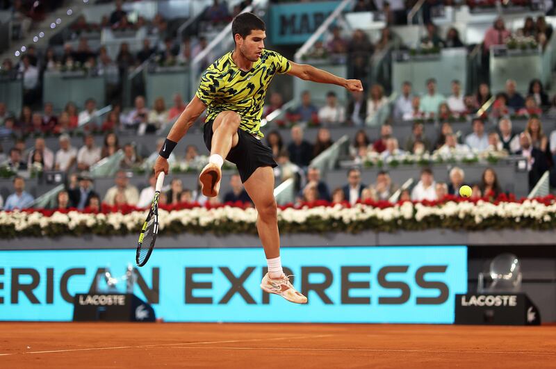 Carlos Alcaraz of Spain plays a shot through his legs against Grigor Dimitrov of Bulgaria during the Mutua Madrid Open on April 30th. Photograph: Julian Finney/Getty Images