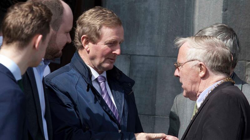 Acting Taoiseach Enda Kenny (centre) and Cllr Christy Burke (right) at the funeral of Martin O’Rourke who was shot dead in a case of mistaken identity by a hired gunman in a gang-related attack in Dublin. Photograph: RollingNews.ie