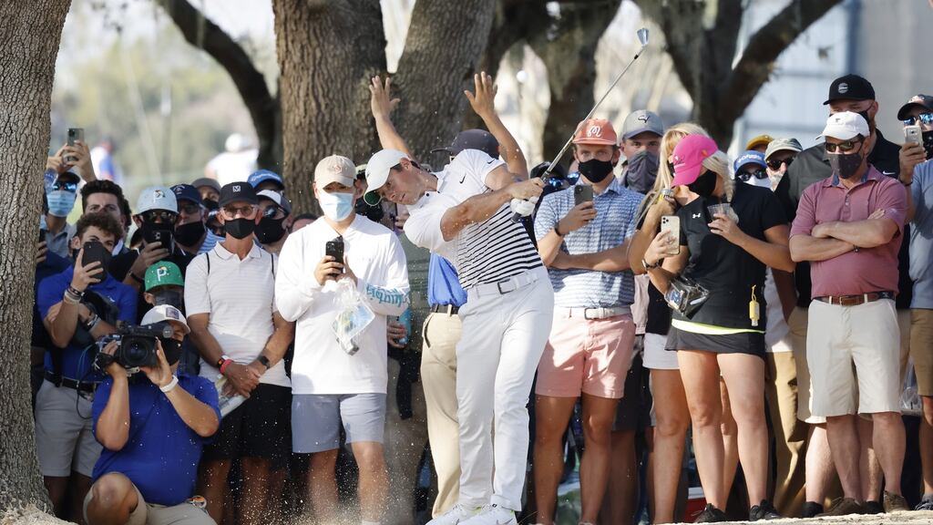 Rory McIlroy hits from the edge of the gallery on the 16th hole during the second round of the Arnold Palmer Invitational at the Bay Hill Club & Lodge in Orlando, Florida. Photo: Erik S. Lesser/EPA