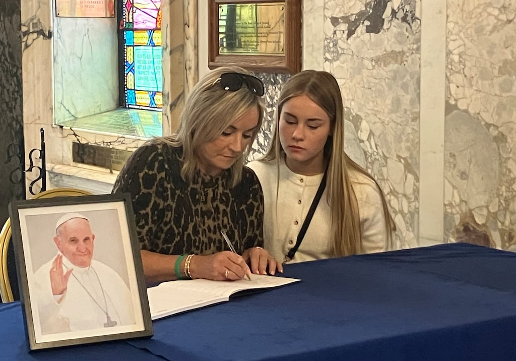 Brona and Grace McAree at Belfast City Hall signing book of condolence for the late Pope Francis. Photo: Seanin Graham