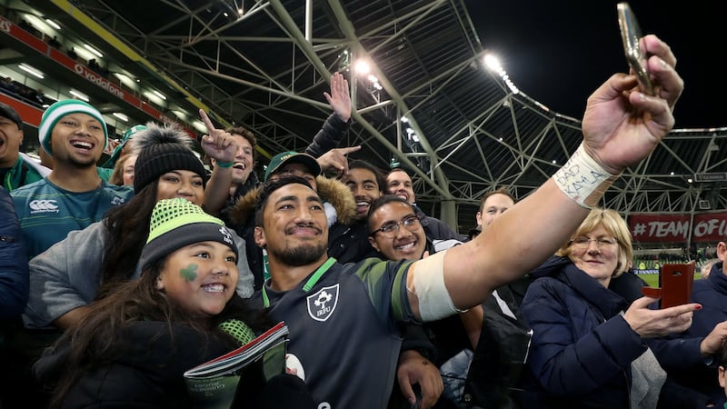 Bundee Aki takes a selfie with his family after the match. Photograph: Dan Sheridan/Inpho