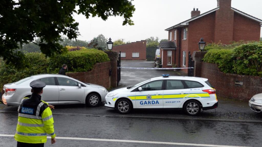 Gardaí at the house where  Marie Quigley was found dead  near Hackballscross, Co Louth. Photograph: Eric Luke/The Irish Times