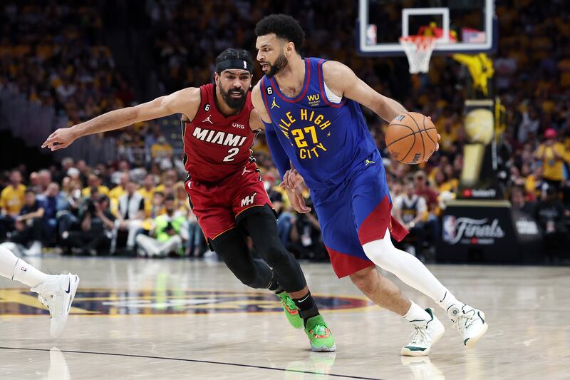 Jamal Murray of the Denver Nuggets drives against Gabe Vincent of the Miami Heat during the second quarter of the match. Photograph: Matthew Stockman/Getty Images