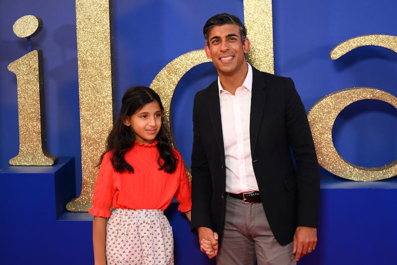 Conservative party leader Rishi Sunak photographed with his daughter Krishna on the red carpet to attend the world premiere of the Roald Dahl's Matilda The Musical, during the 2022 BFI London Film Festival in London on October 5th, 2022. Photo by Daniel LEAL / AFP