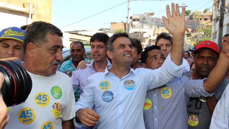 Brazilian Social Democracy Party presidential candidate Aecio Neves (C) attends an electoral campaing at Pedreira Padro Lopes in Belo Horizonte. Photograph: Paulo Fonseca/EPA.