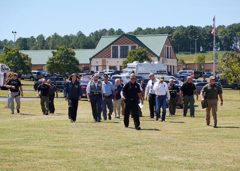 Barrow County law enforcement members arrive to speak to the media after the shooting. Photograph: Megan Varner/Getty Images