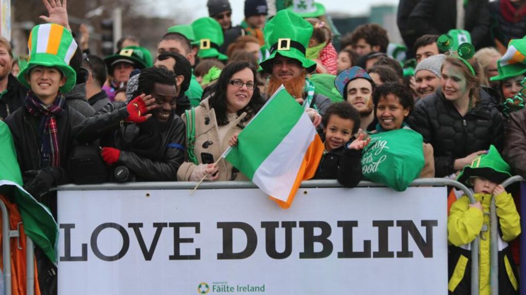 Crowds during the Dublin St Patrick’s Day parade, which made its way down O’Connell Street towards St Patrick’s Cathedral. Photograph: Niall Carson/PA