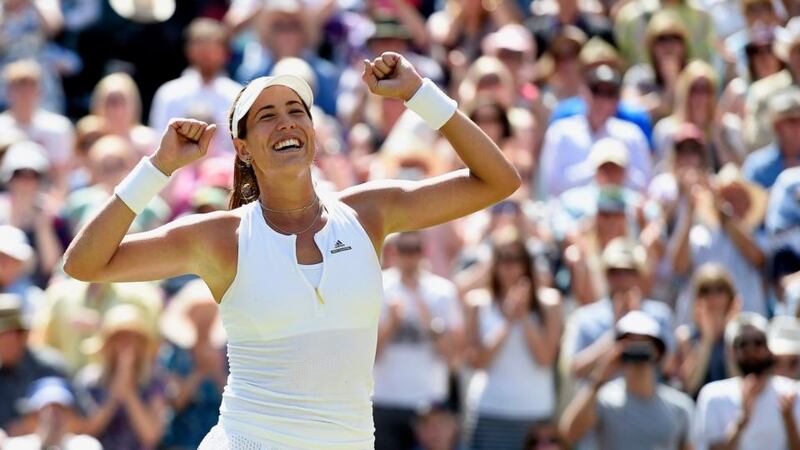 Garbine Muguruza of Spain celebrates after beating Poland’s Agnieszka Radwanska during their semi-final match at Wimbledon. Photograph: Facundo Arrizabalaga/EPA