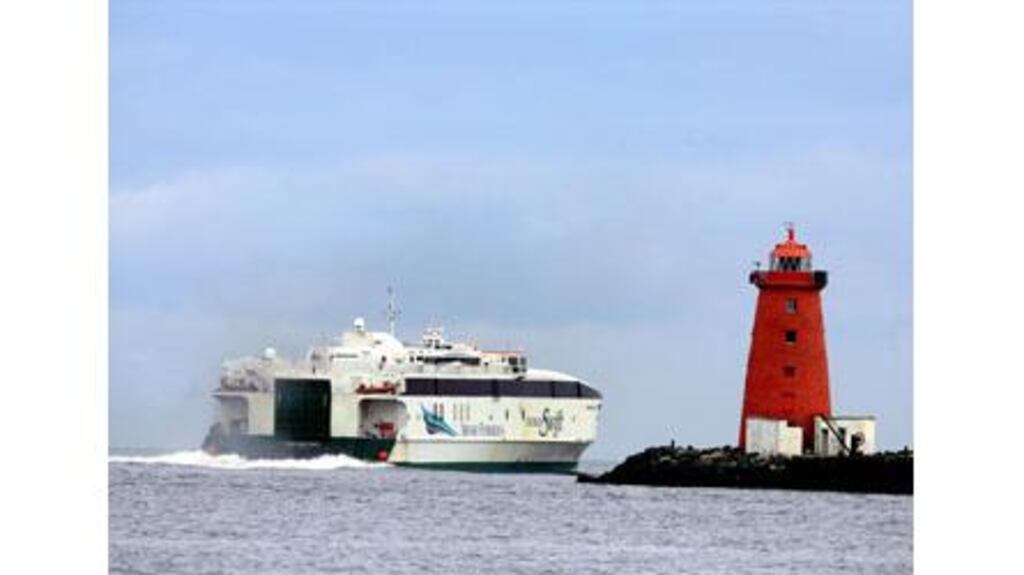 Jonathan Swift, an Irish Ferries' vessel, passes Poolbeg Lighthouse on its way out of Dublin Port yesterday.