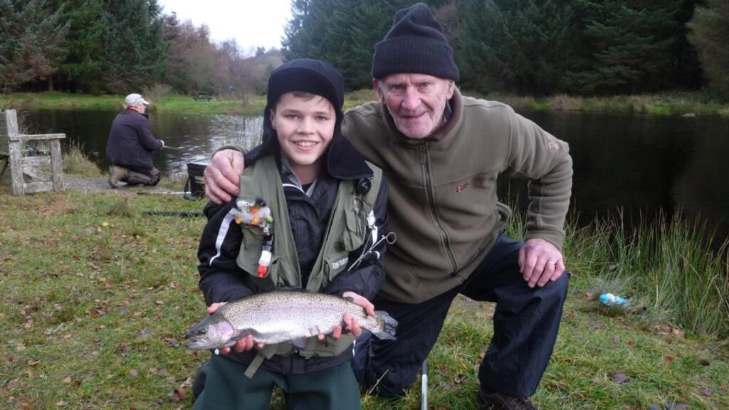 Cory Ryan (14) with a fine rainbow trout of 49cms, alongside his proud granddad, Mike, during the winter league final at Annamoe Trout Fisheries, Co Wicklow