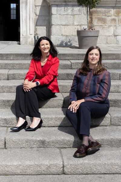 Nora Trench Bowles and Fiona Gamble on the steps of Trinity College’s dining hall