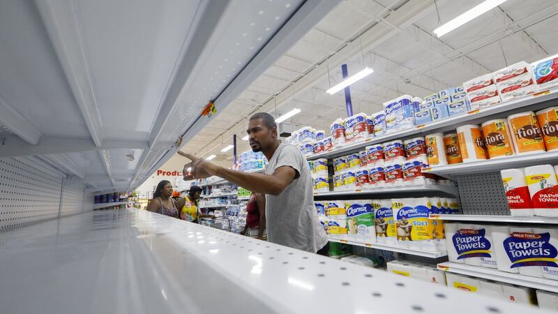A shopper inspects water shelves at the Presidente Supermarket in the Little Haiti neighbourhood ahead of the expected arrival of Hurricane Irma in Miami, Florida, September 7th, 2017. Photograph: Erik S Lesser/EPA