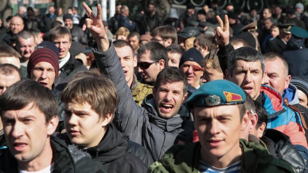 Pro-Russian activists gather to form a local public guard to oppose pro-EU groups in Simferopol in the Crimea yesterday. Photograph: Reuters