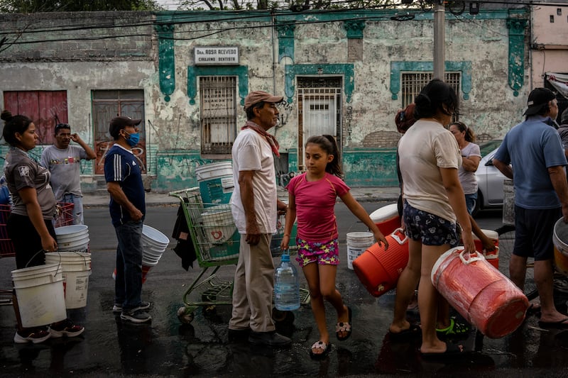 Residents line up to fill their containers with water in Monterrey, the second largest city in Mexico. Photograph: Cesar Rodriguez/New York Times