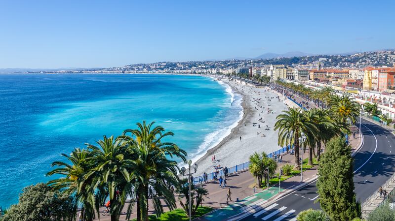 Enjoy a stroll along Promenade des Anglais in Nice