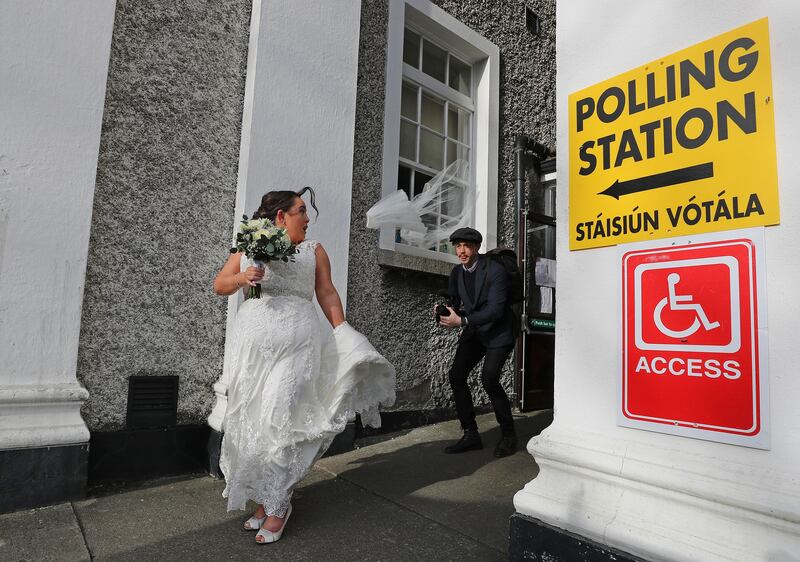 Veil Away: The effect of a gust of wind on Bride to be Aisling Barron who was en-route to getting married at the Church of St Vincent de Paul on Griffith Avenue; prior to the ceremony both Aisling and her father Ken voted at the Polling station in St Vincent de Paul Girl's school. Photograph Nick Bradshaw/The Irish Times