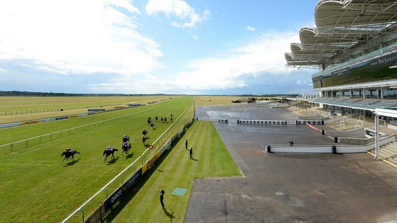 Oisin Murphy (L) takes the 2,000 Guineas at an empty Newmarket. Photograph: Edward Whitaker/Getty