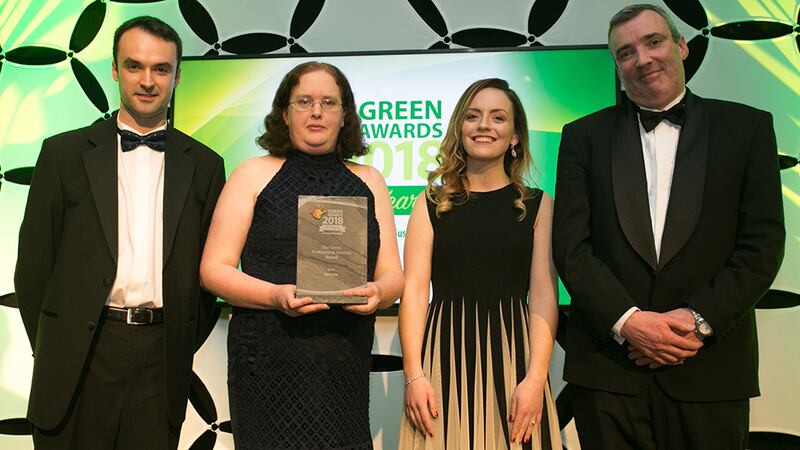 John Keohane, CEO, Verde LED presents The Green Professional Services award to John Gray, Gemma Osaseyi & Eimear Dempsey, Deloitte.