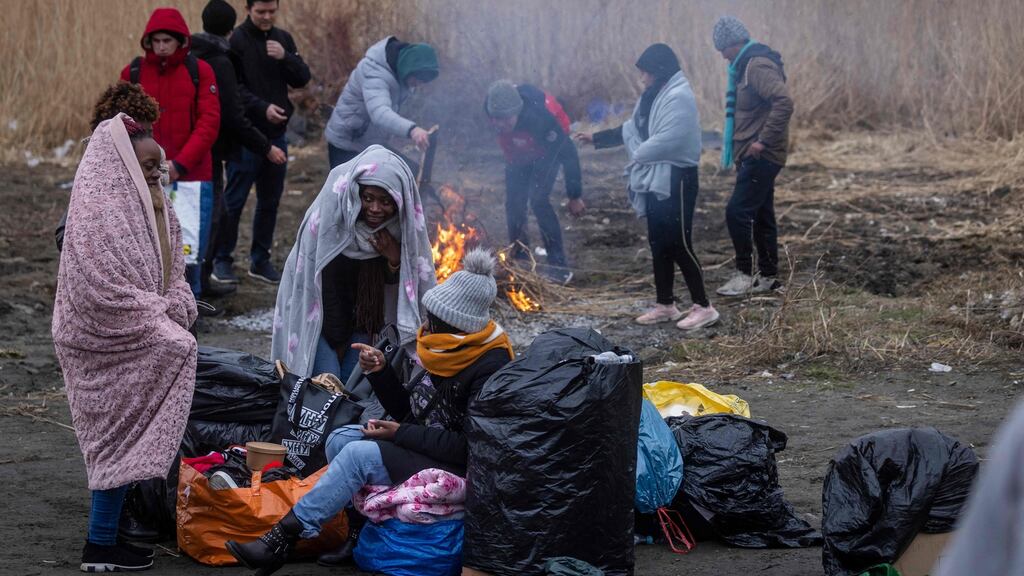Refugees from Africa, the Middle East and India, mostly students of Ukrainian universities, at the Medyka pedestrian border crossing in eastern Poland as they flee the conflict in Ukraine. Photograph: Wojtek Radwanski/AFP/via Getty Images