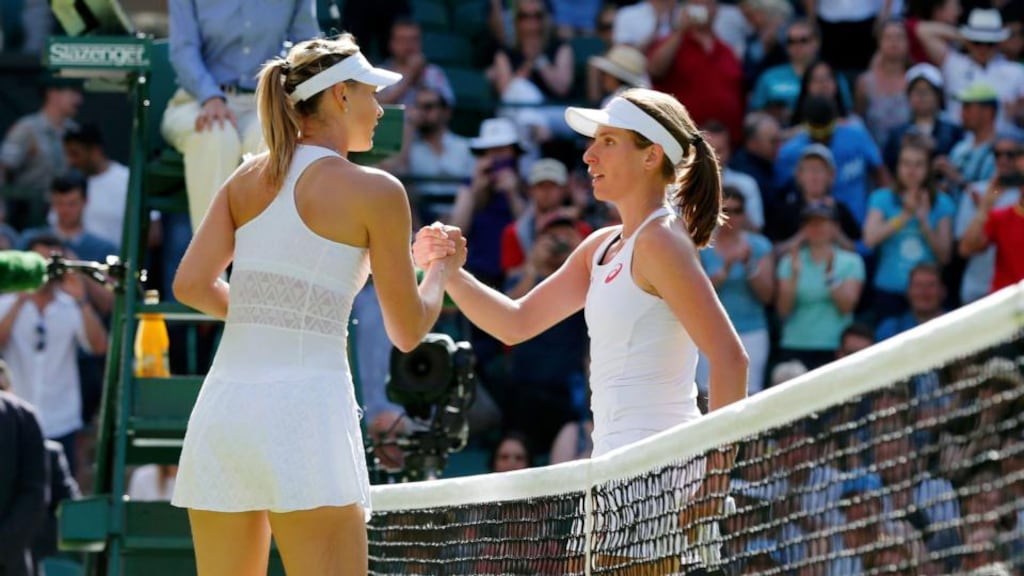 Maria Sharapova of Russia shakes the hand of Johanna Konta of Britain after winning their first round match at the Wimbledon Tennis Championships. Photo: Suzanne Plunkett/Reuters