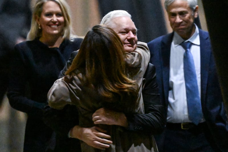 WikiLeaks founder Julian Assange hugs his wife Stella after arriving at Canberra Airport. Photograph: William West/AFP via Getty Images