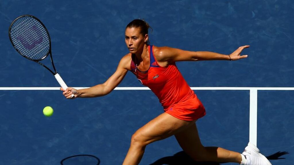 Flavia Pennetta of Italy plays a forehand during her women’s singles quarter-final match against Roberta Vinci of Italy. Photograph: Al Bello/Getty Images