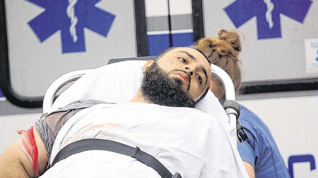 Ahmad Khan Rahami is taken into custody in connection with Saturday’s bombings in New York. Photograph: Nicolaus Czarnecki/Boston Herald/AFP