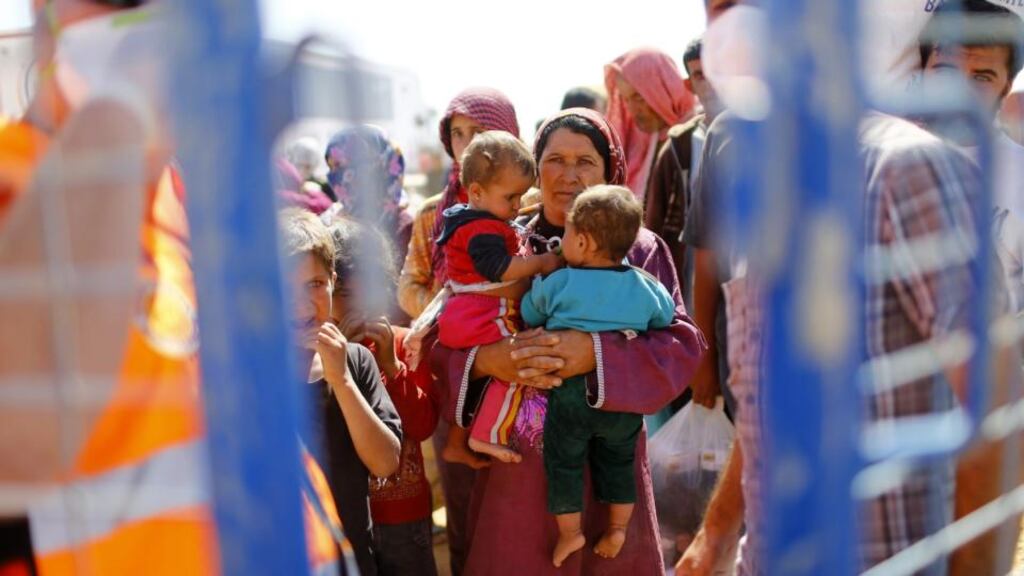 ‘Within a week, 150,000 refugees from Syria streamed into Turkey, adding to the million-plus refugees Turkey has accommodated in the three-and-a-half years since the devastating conflict in Syria began.’ Above, Syrian refugees cross the Syrian-Turkish border near Sanliurfa, Turkey, on September 26th. Photograph: EPA/Sedat Suna