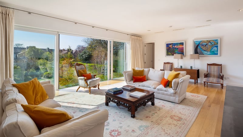 A most elegant drawing room to the rear that carries the width of the house