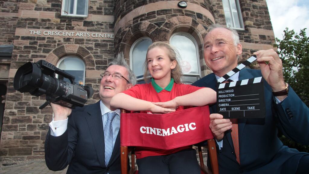 Chief executive of the Worldwide Ireland Funds, Kieran McLoughlin (l), Angel Regan (11) from North Belfast and Chairman of the American Ireland Fund, John Fitzpatrick on a visit to Cinemagic, a project in receipt of financial support from the Ireland Funds. Photograph: Aengus McMahon