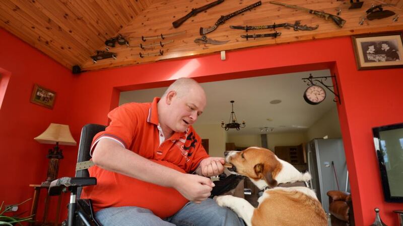 Victor Connell with his pet dog at home. Photograph: Alan Betson