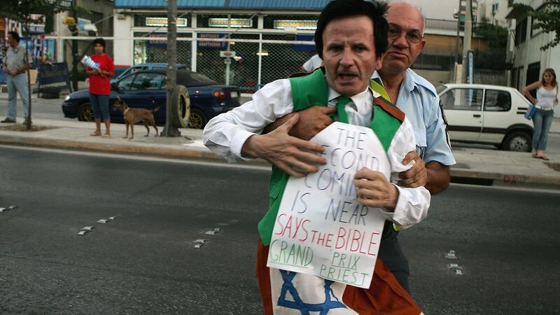 Cornelius Horan is arrested after tackling Vanderlei Lima during the marathon at the 2004 Athens Olympics. Photograph: Nick Laham/Getty Images