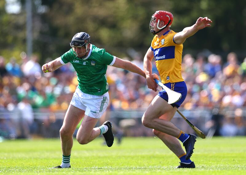 Limerick’s Diarmaid Byrnes and Peter Duggan of Clare. Photograph: James Crombie/Inpho