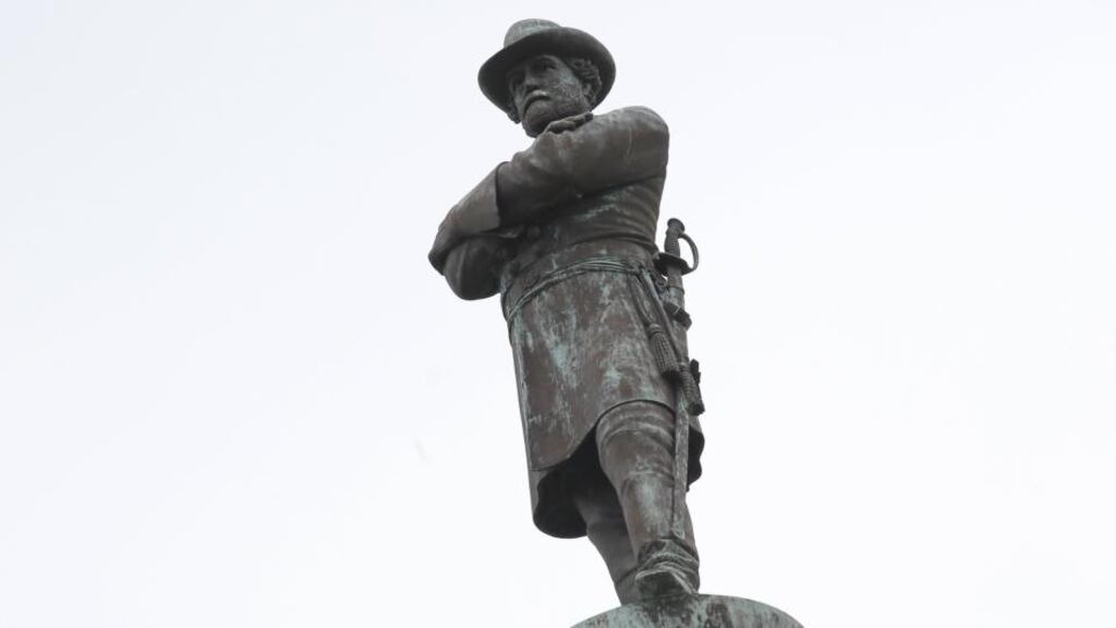 A monument to Confederate General Robert E Lee towers over a traffic circle in New Orleans, Louisiana. Photograph: Jonathan Bachman/Reuters
