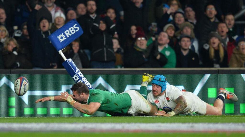 England’s wing Jack Nowell manages to tackles Ireland’s centre Robbie Henshaw in time to prevent a try during the Six Nations international rugby union match. Photograph: Getty Images
