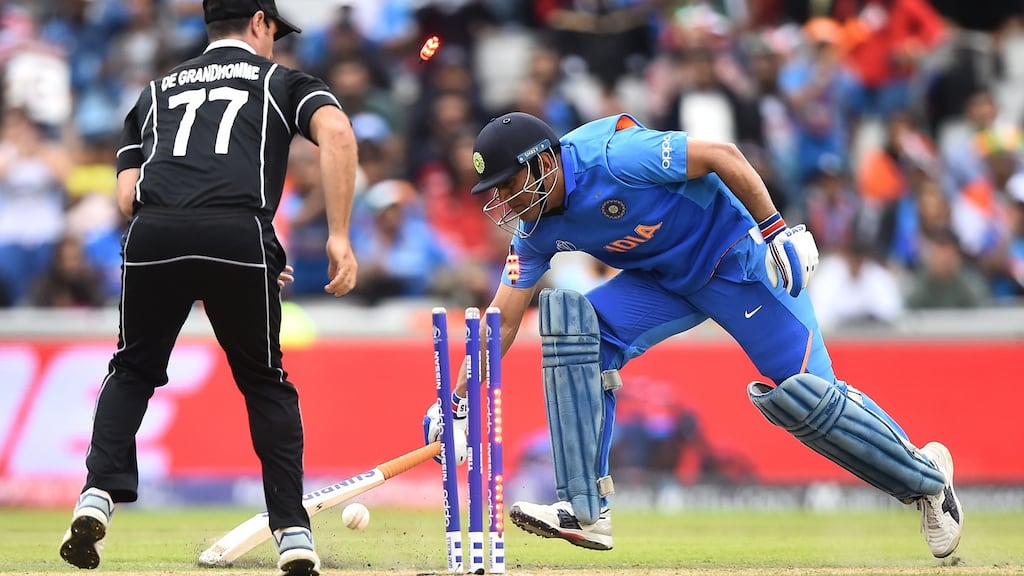 MS Dhoni of India is run out by Martin Guptill of New Zealand during the semi-final of the ICC Cricket World Cup. Photo: Nathan Stirk/Getty Images